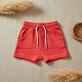 Short rouge corail lacet blanc – fond bohème